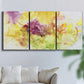 Three-panel canvas wall art featuring abstract floral rhythm composition, displayed in a living room above a sofa.