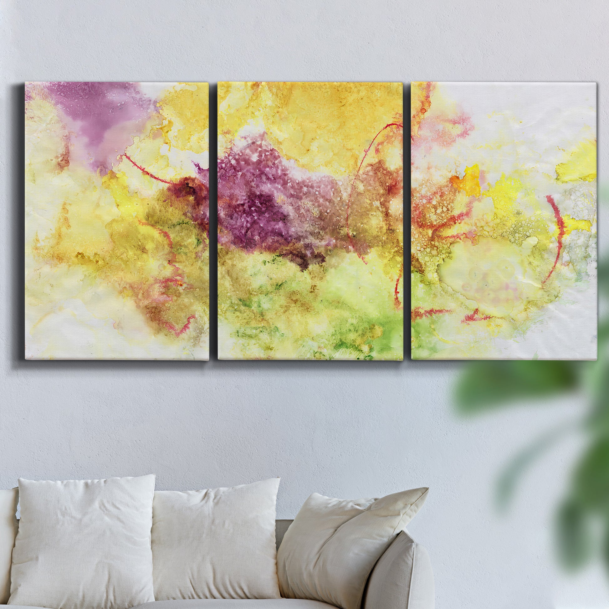 Three-panel canvas wall art featuring abstract floral rhythm composition, displayed in a living room above a sofa.