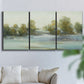 Three-panel canvas wall art featuring calming scenic landscape view, displayed in a living room above a sofa.