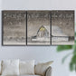 Three-panel canvas wall art featuring rustic winter holiday text art, displayed in a living room above a sofa.