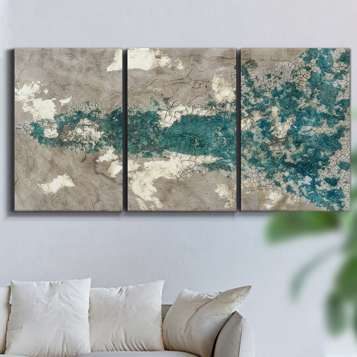 Three-panel canvas wall art featuring layered mineral abstract textures, displayed in a living room above a sofa.
