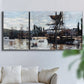 Three-panel canvas wall art featuring harbor scene with boats and quays, displayed in a living room above a sofa.