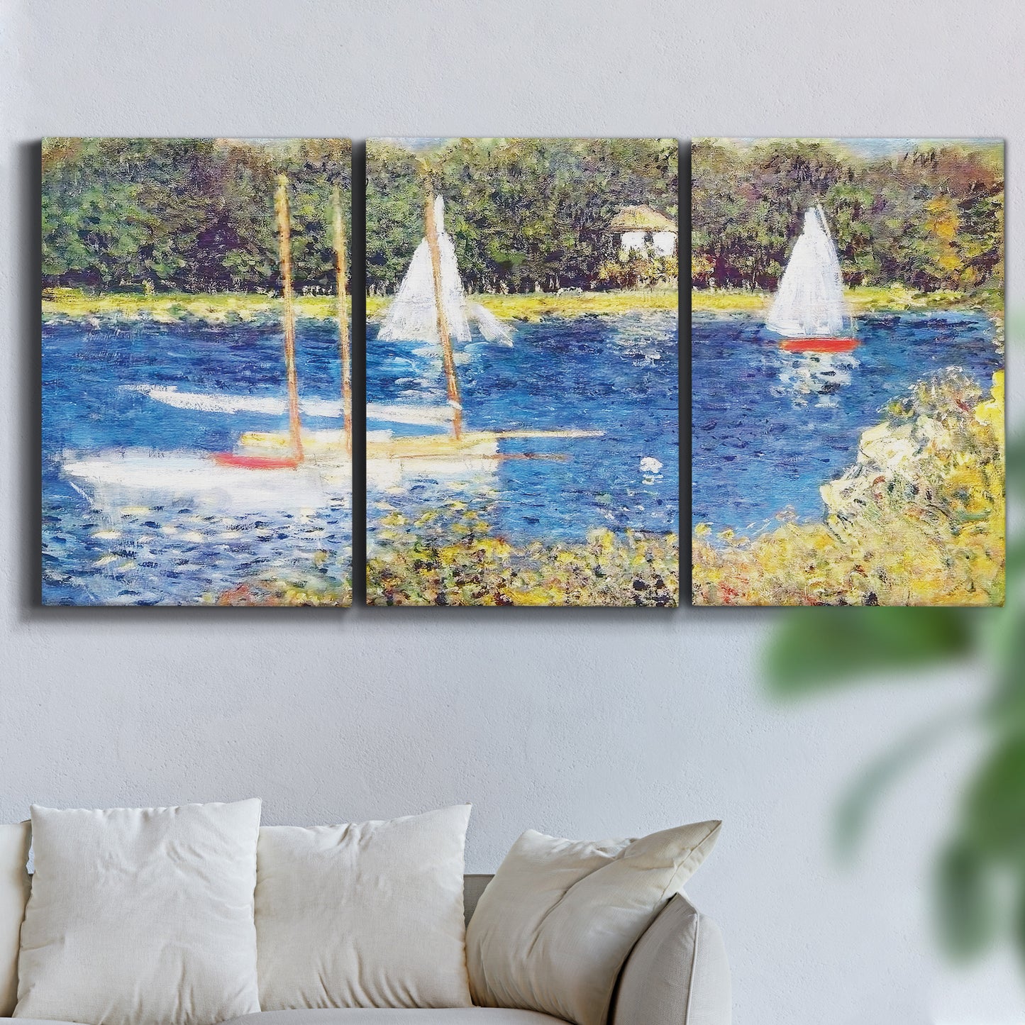 Three-panel canvas wall art featuring river scene with reflections, displayed in a living room above a sofa.