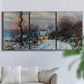 Three-panel canvas wall art featuring snow covered road leading to village, displayed in a living room above a sofa.
