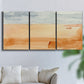 Three-panel canvas wall art featuring minimal horizon with soft blue tones, displayed in a living room above a sofa.