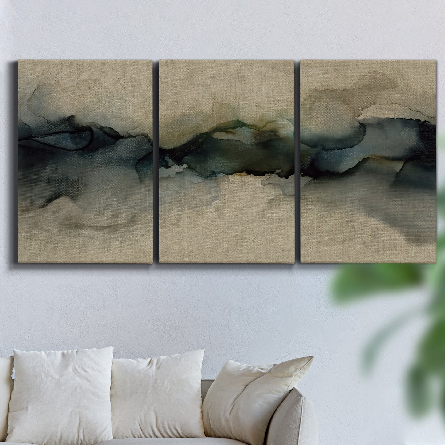 Three-panel canvas wall art featuring calm abstract water surface stillness, displayed in a living room above a sofa.