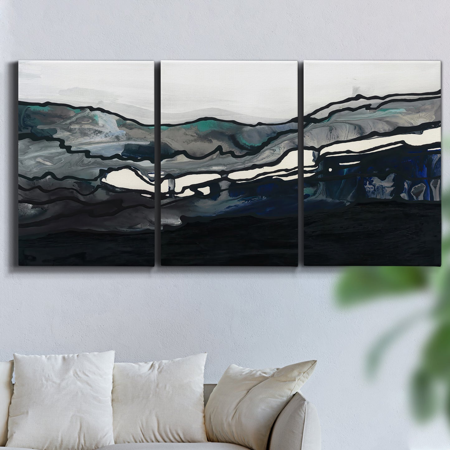 Three-panel canvas wall art featuring abstract passage of time composition, displayed in a living room above a sofa.