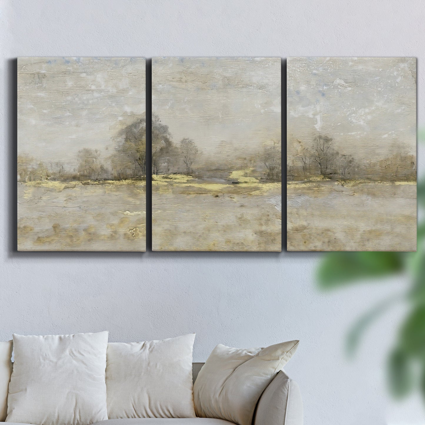 Three-panel canvas wall art featuring late season rural harvest fields, displayed in a living room above a sofa.