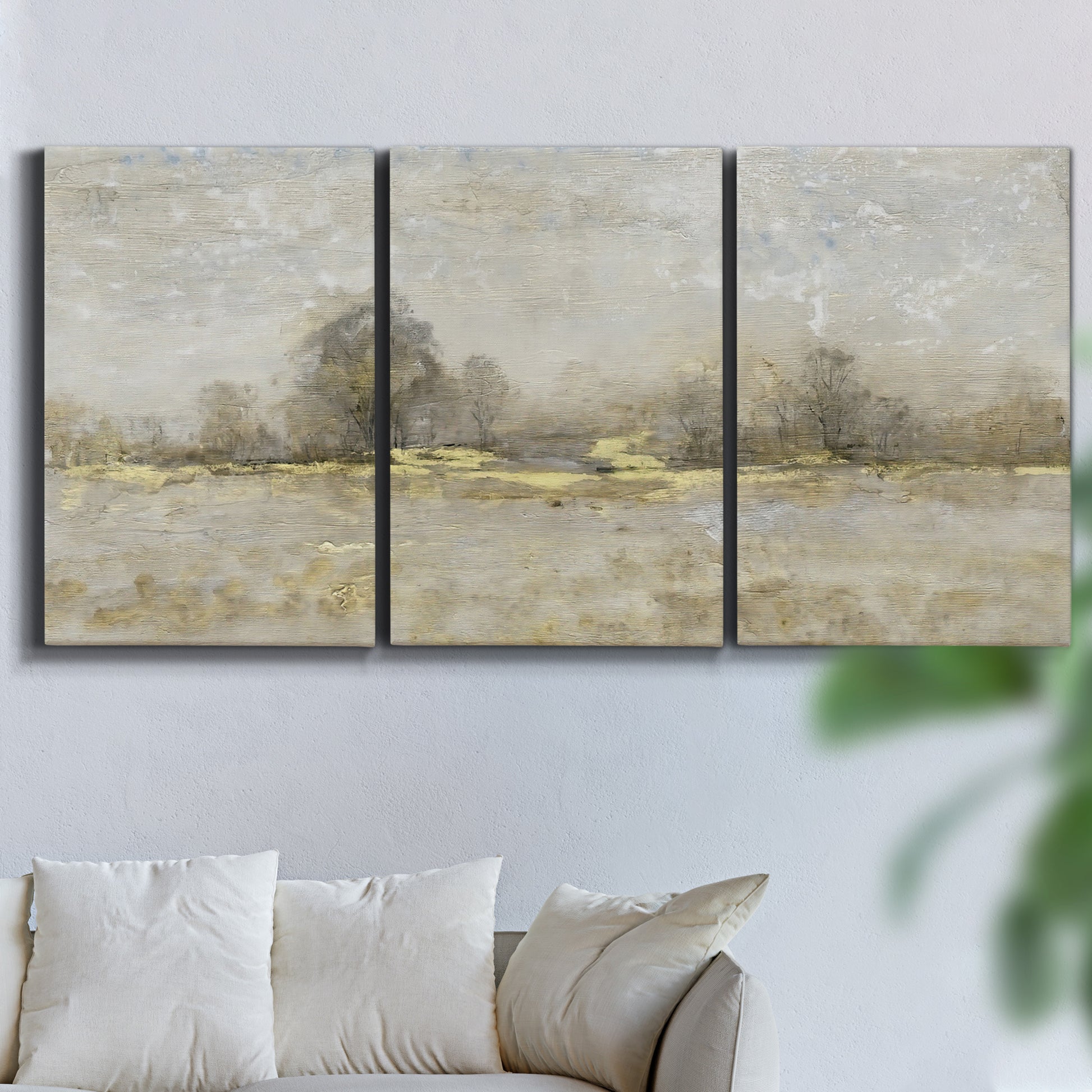 Three-panel canvas wall art featuring late season rural harvest fields, displayed in a living room above a sofa.