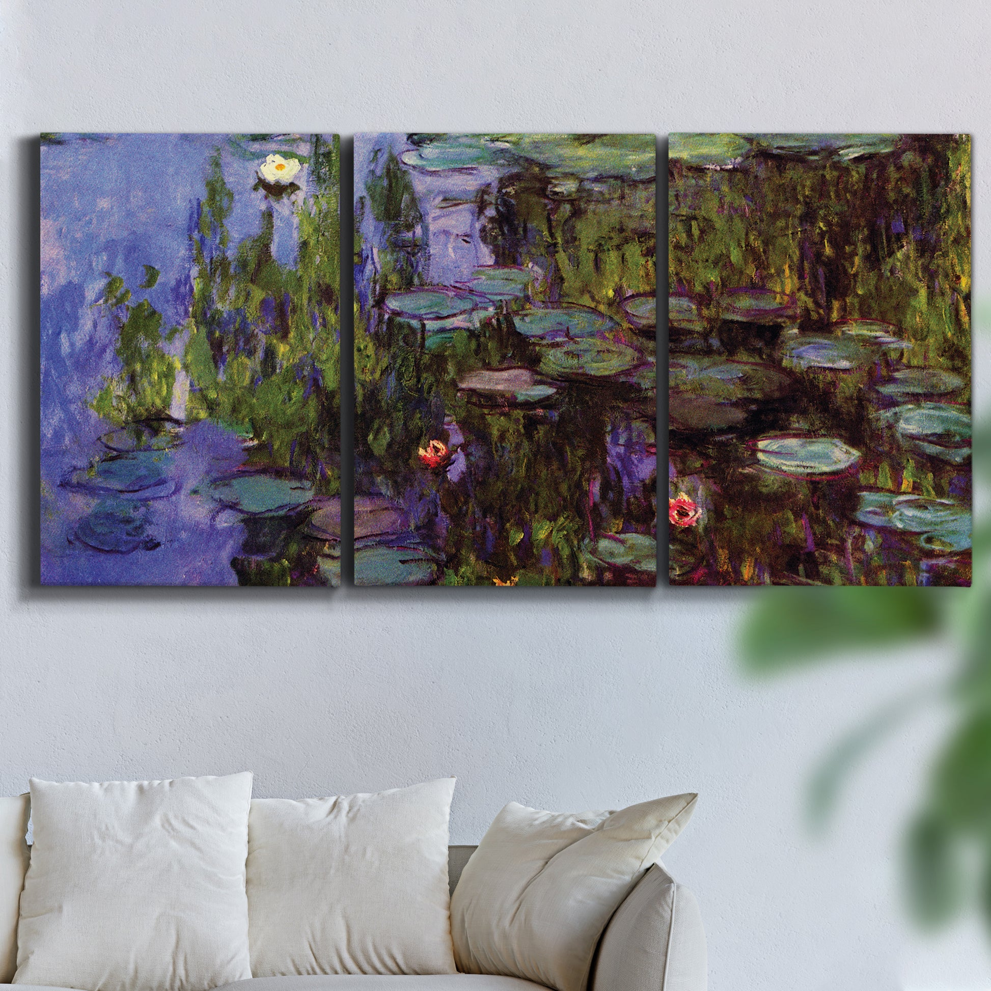 Three-panel canvas wall art featuring water lilies on calm pond, displayed in a living room above a sofa.