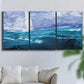 Three-panel canvas wall art featuring impressionist nautical harbor scene, displayed in a living room above a sofa.