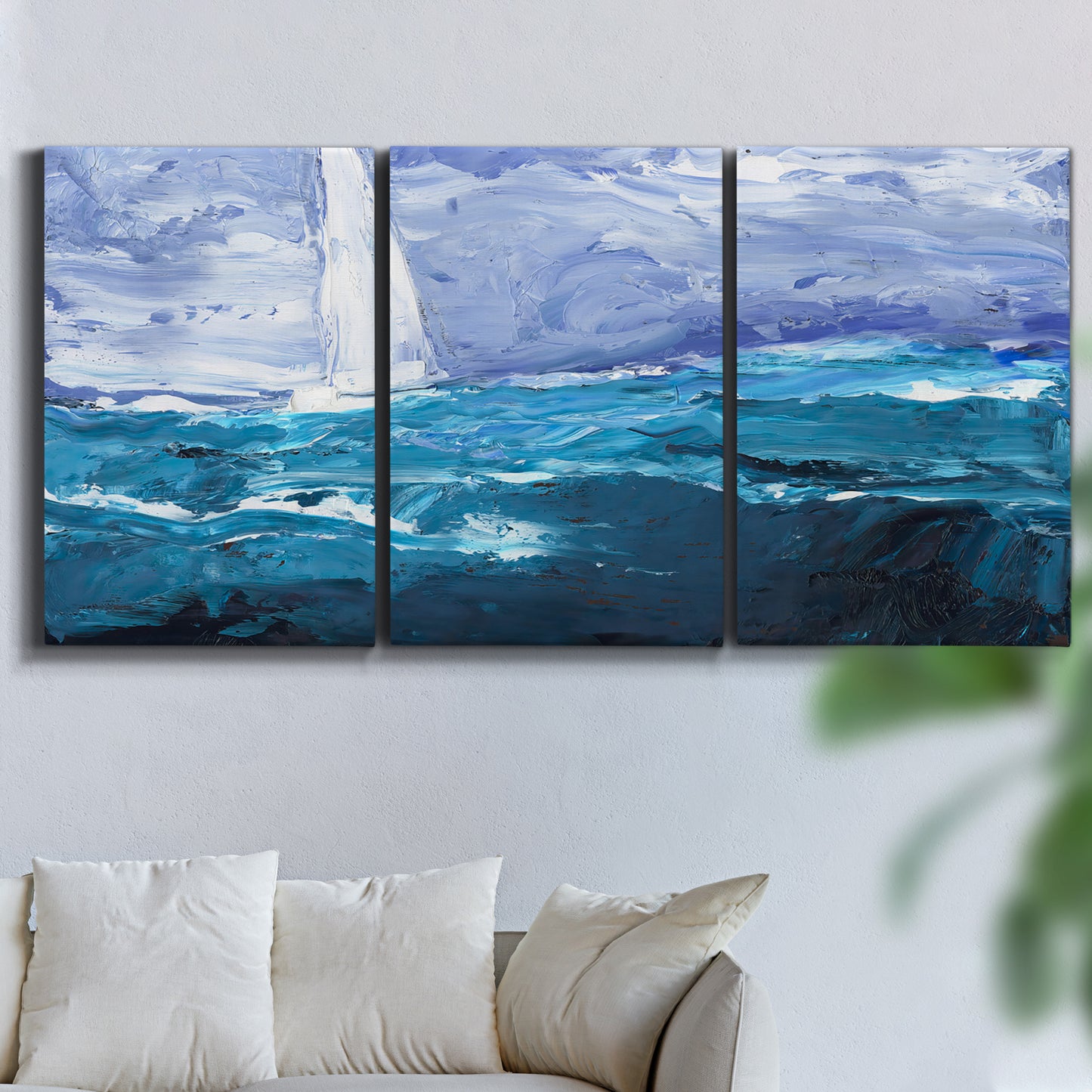 Three-panel canvas wall art featuring impressionist nautical harbor scene, displayed in a living room above a sofa.