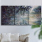 Three-panel canvas wall art featuring misty river scene in morning light, displayed in a living room above a sofa.