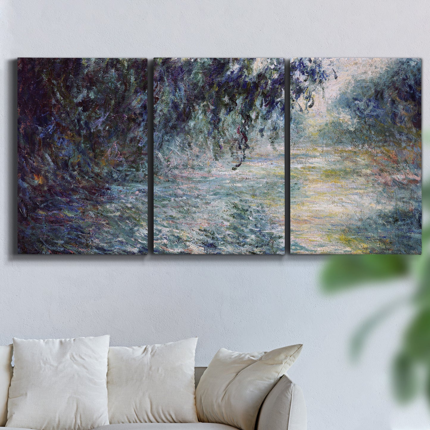 Three-panel canvas wall art featuring misty river scene in morning light, displayed in a living room above a sofa.