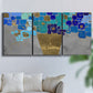 Three-panel canvas wall art featuring blue floral abstract botanical expression, displayed in a living room above a sofa.
