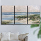 Three-panel canvas wall art featuring soft morning light over calm sea, displayed in a living room above a sofa.