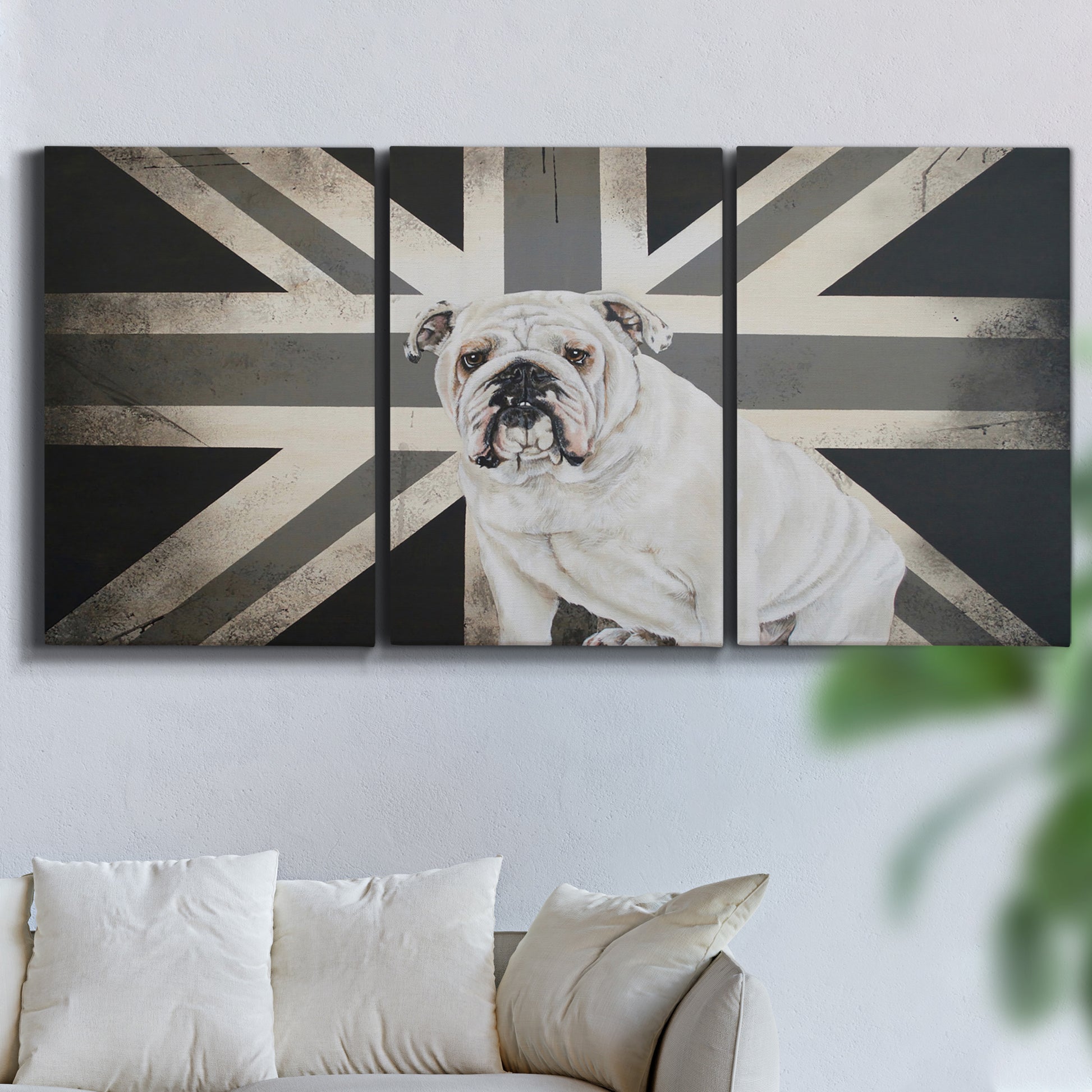 Three-panel canvas wall art featuring black and white animal collage, displayed in a living room above a sofa.