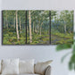 Three-panel canvas wall art featuring woodland forest scene with tall trees, displayed in a living room above a sofa.