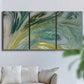 Three-panel canvas wall art featuring layered modern abstract landscape, displayed in a living room above a sofa.
