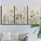 Three-panel canvas wall art featuring loose farmhouse style floral painting, displayed in a living room above a sofa.