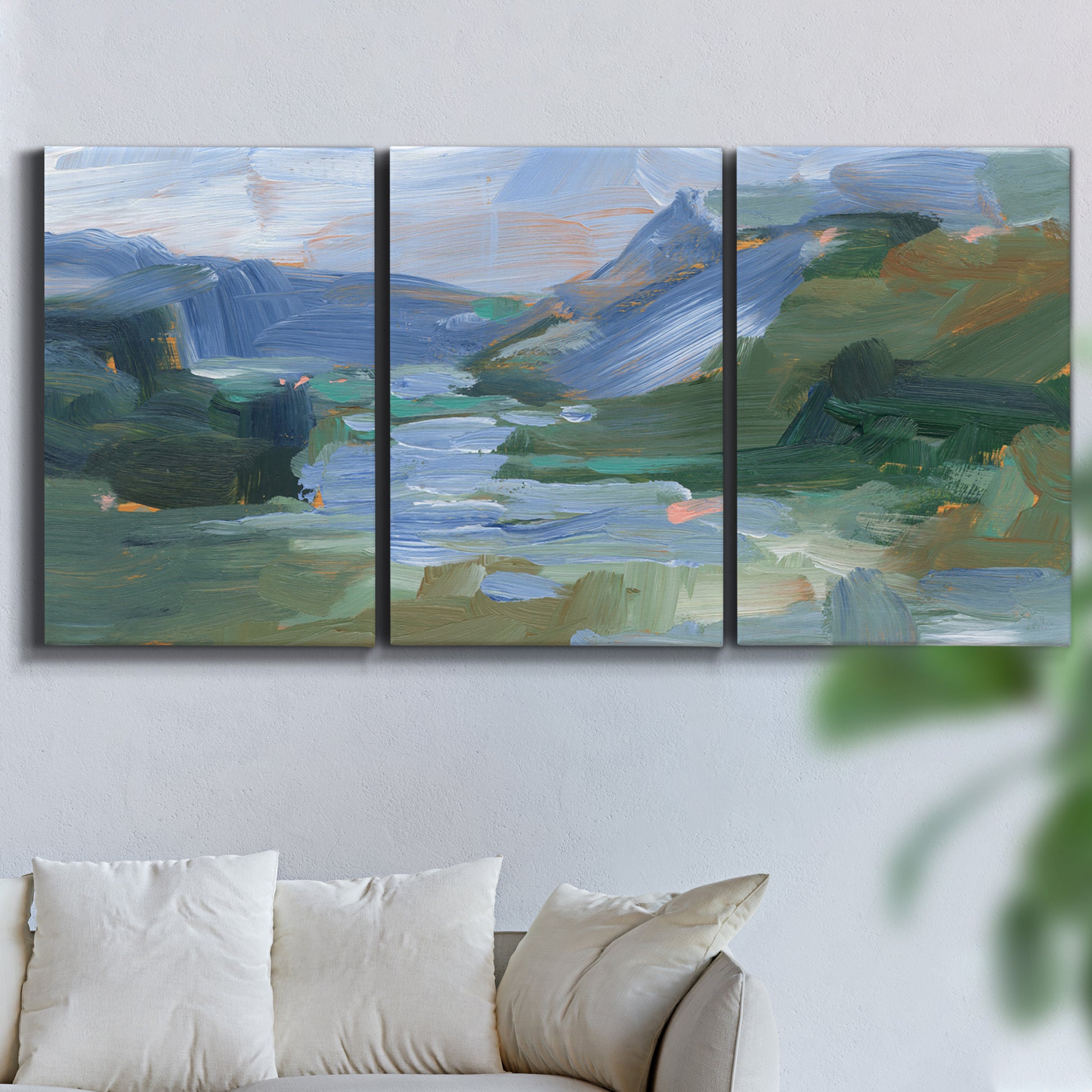 Three-panel canvas wall art featuring abstract landscape composition study, displayed in a living room above a sofa.