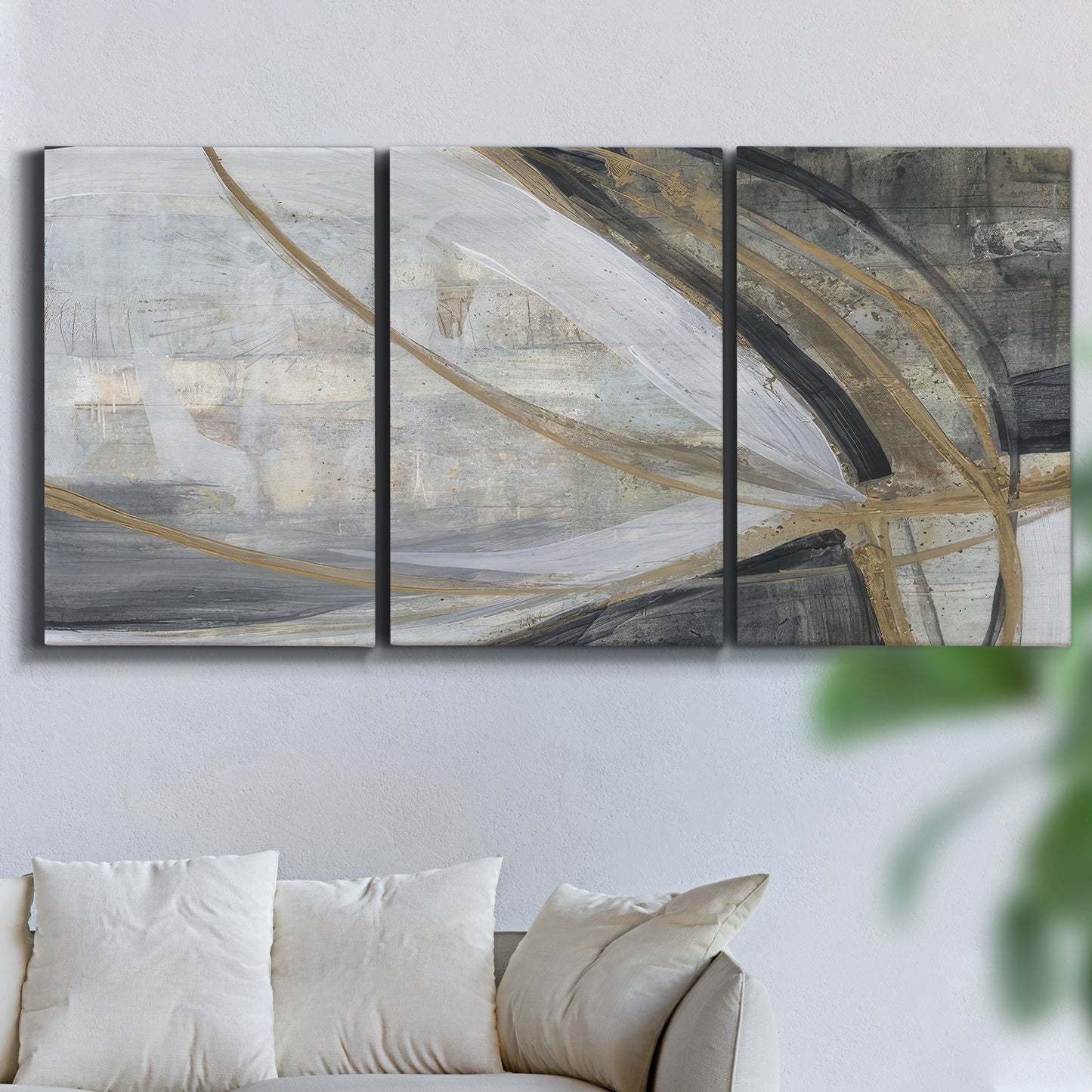 Three-panel canvas wall art featuring spiraling abstract vortex motion, displayed in a living room above a sofa.