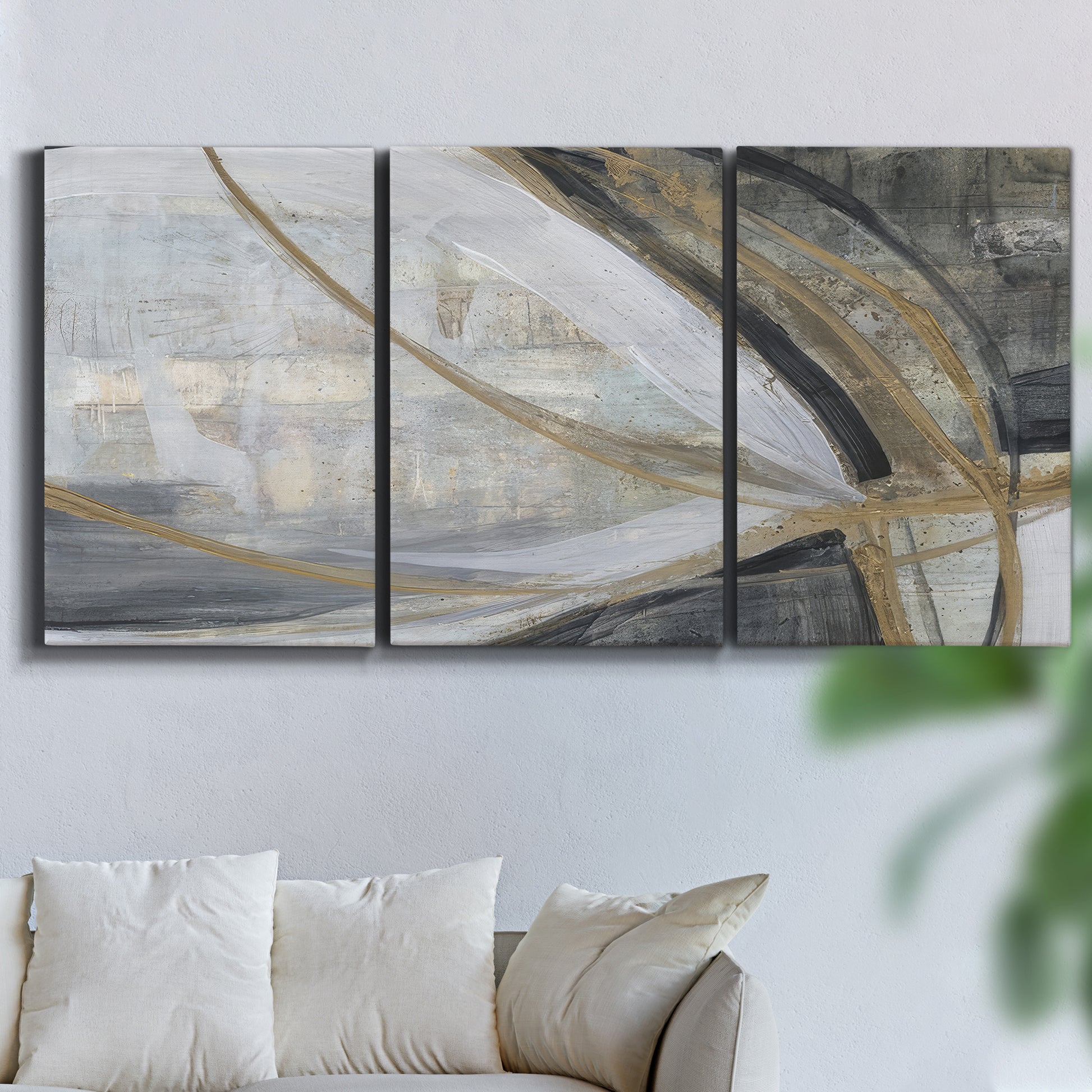 Three-panel canvas wall art featuring spiraling abstract vortex motion, displayed in a living room above a sofa.