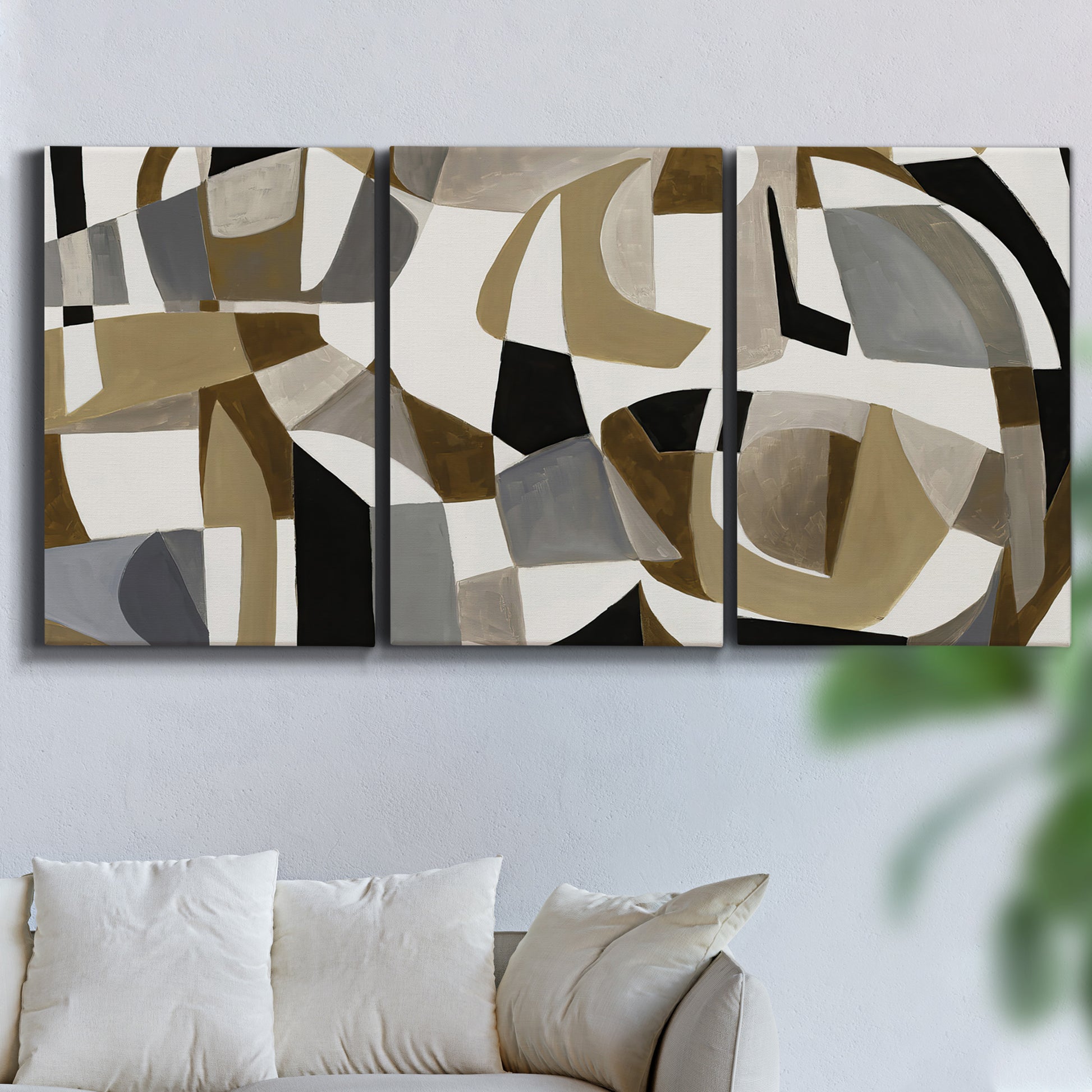 Three-panel canvas wall art featuring overlapping mid century geometric shapes, displayed in a living room above a sofa.