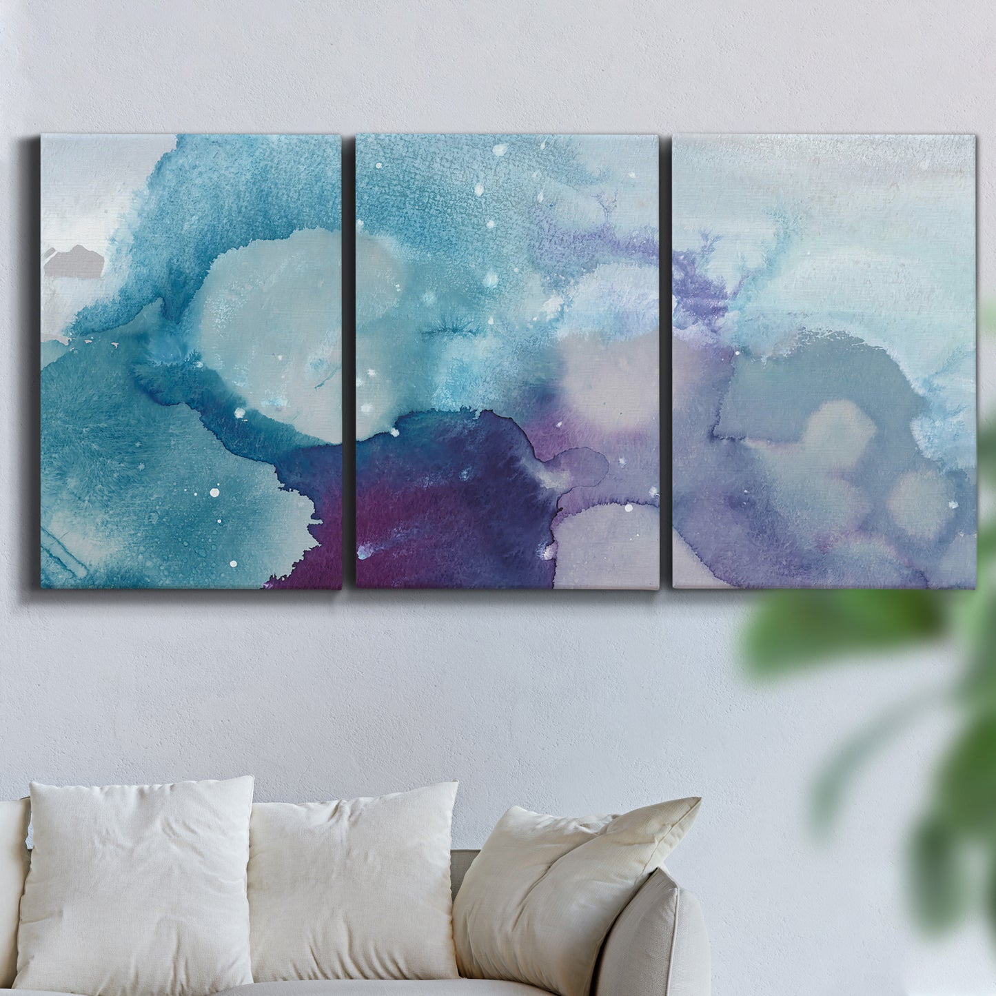 Three-panel canvas wall art featuring icy abstract crystalline forms, displayed in a living room above a sofa.