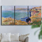 Three-panel canvas wall art featuring coastal village view near dieppe, displayed in a living room above a sofa.