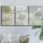 Three-panel canvas wall art featuring whimsical vertical tree landscape, displayed in a living room above a sofa.