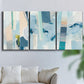 Three-panel canvas wall art featuring layered geometric abstract strata forms, displayed in a living room above a sofa.