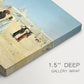 Canvas art print of figures traveling across desert with distant city and tombs on horizon, highlighting texture and gallery-wrapped edges