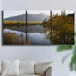 Three-panel canvas wall art featuring low light river photography, displayed in a living room above a sofa.