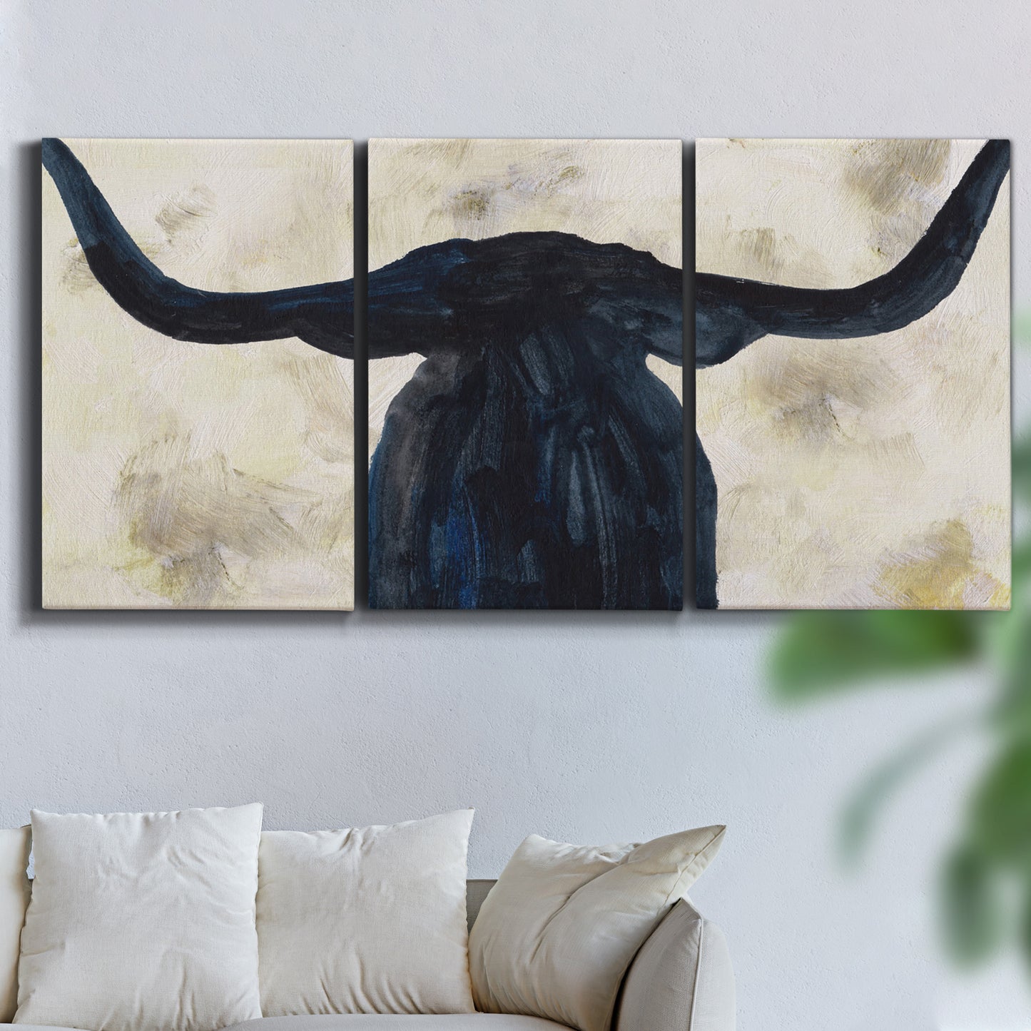 Three-panel canvas wall art featuring rustic animal portrait illustration, displayed in a living room above a sofa.