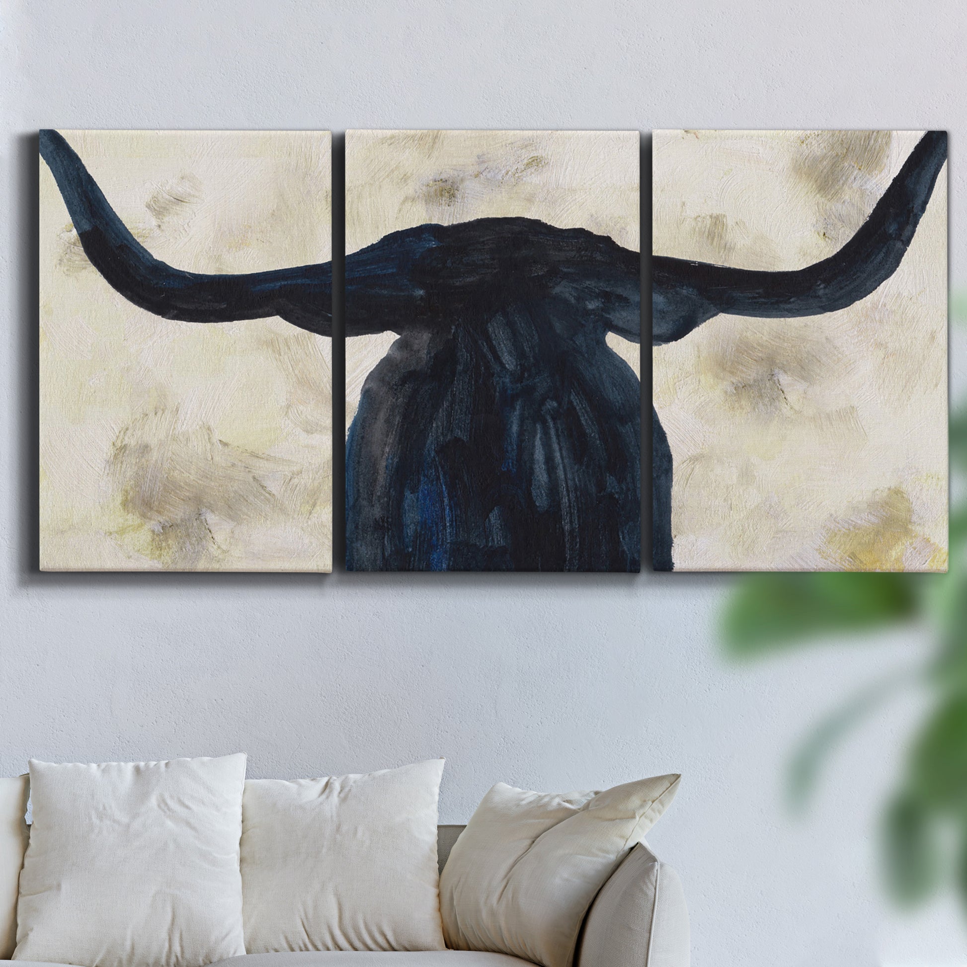 Three-panel canvas wall art featuring rustic animal portrait illustration, displayed in a living room above a sofa.
