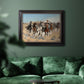 Impressionist western action scene by Frederic Remington in an ornate black frame with gilded inner detail displayed in a dark-toned interior setting.