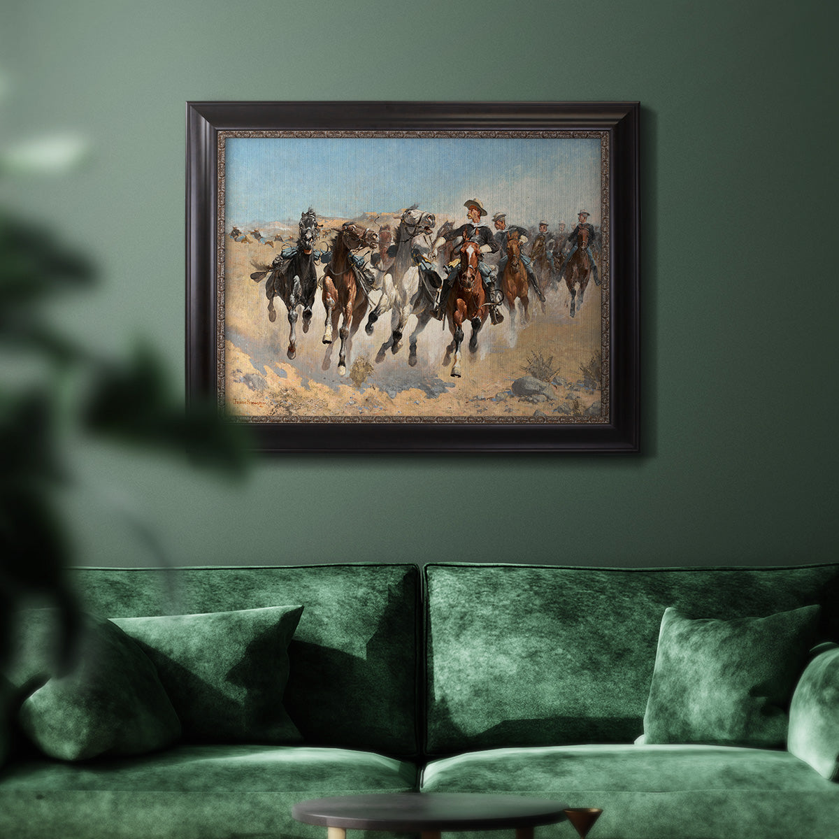 Impressionist western action scene by Frederic Remington in an ornate black frame with gilded inner detail displayed in a dark-toned interior setting.