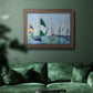 Coastal harbor watercolor painting in an ornate traditional bronze frame displayed in a dark-toned interior setting.