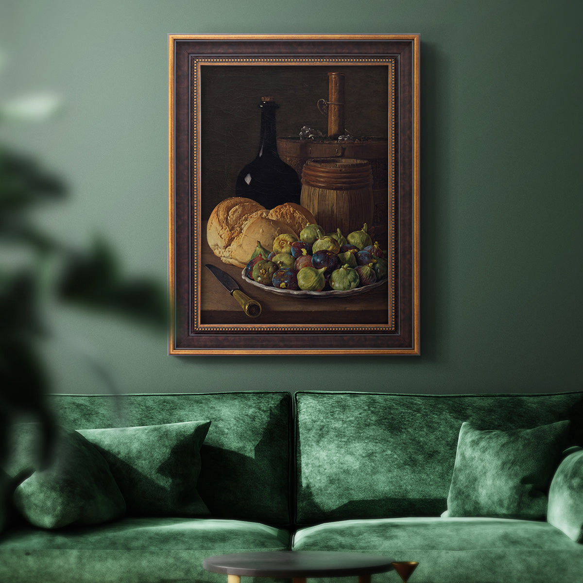 Realist still life with figs and bread by Luis Meléndez in an ornate bronzed mahogany wood frame displayed in a dark-toned interior setting.