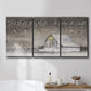 Three-panel canvas wall art featuring rustic winter holiday text art, displayed in a bathroom above a bathtub.