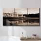 Three-panel canvas wall art featuring monochrome historic pavilion photograph, displayed in a bathroom above a bathtub.