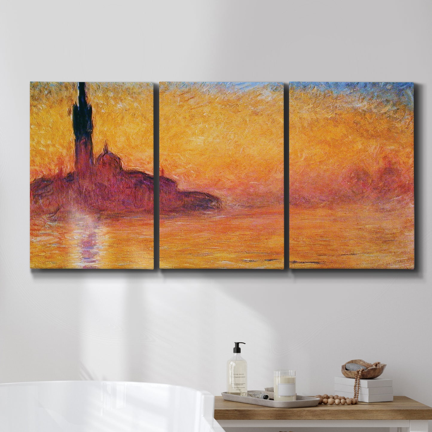 Three-panel canvas wall art featuring venetian church at twilight, displayed in a bathroom above a bathtub.