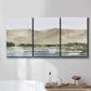 Three-panel canvas wall art featuring desert mountain landscape watercolor, displayed in a bathroom above a bathtub.