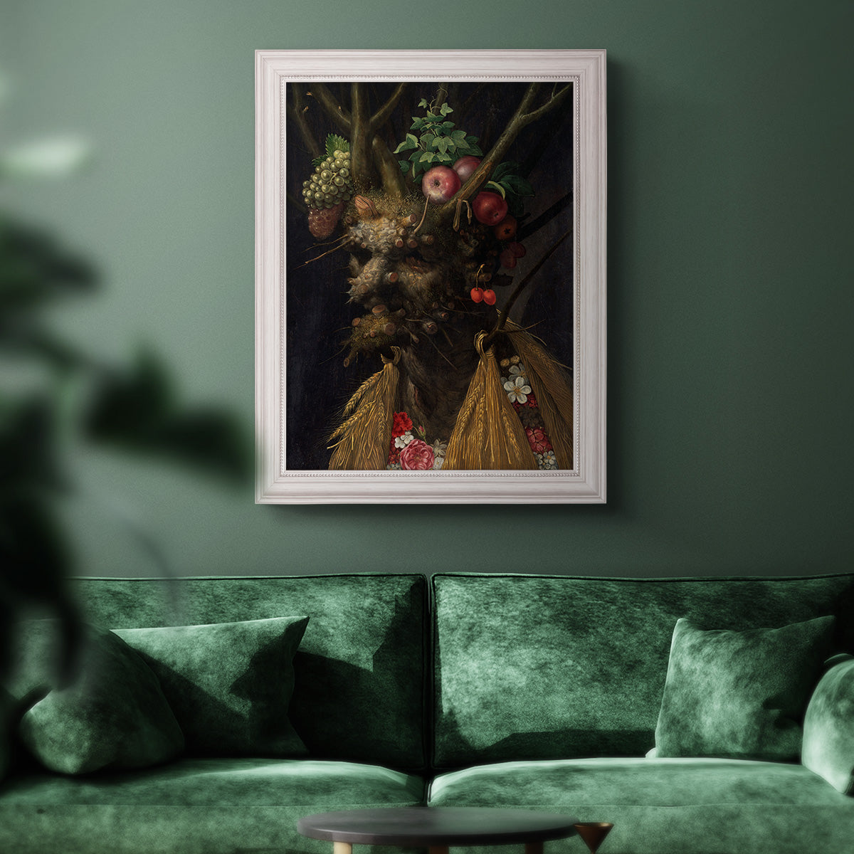 Surreal allegorical portrait representing the four seasons by Giuseppe Arcimboldo in an ornate weathered white frame displayed in a dark-toned interior setting.