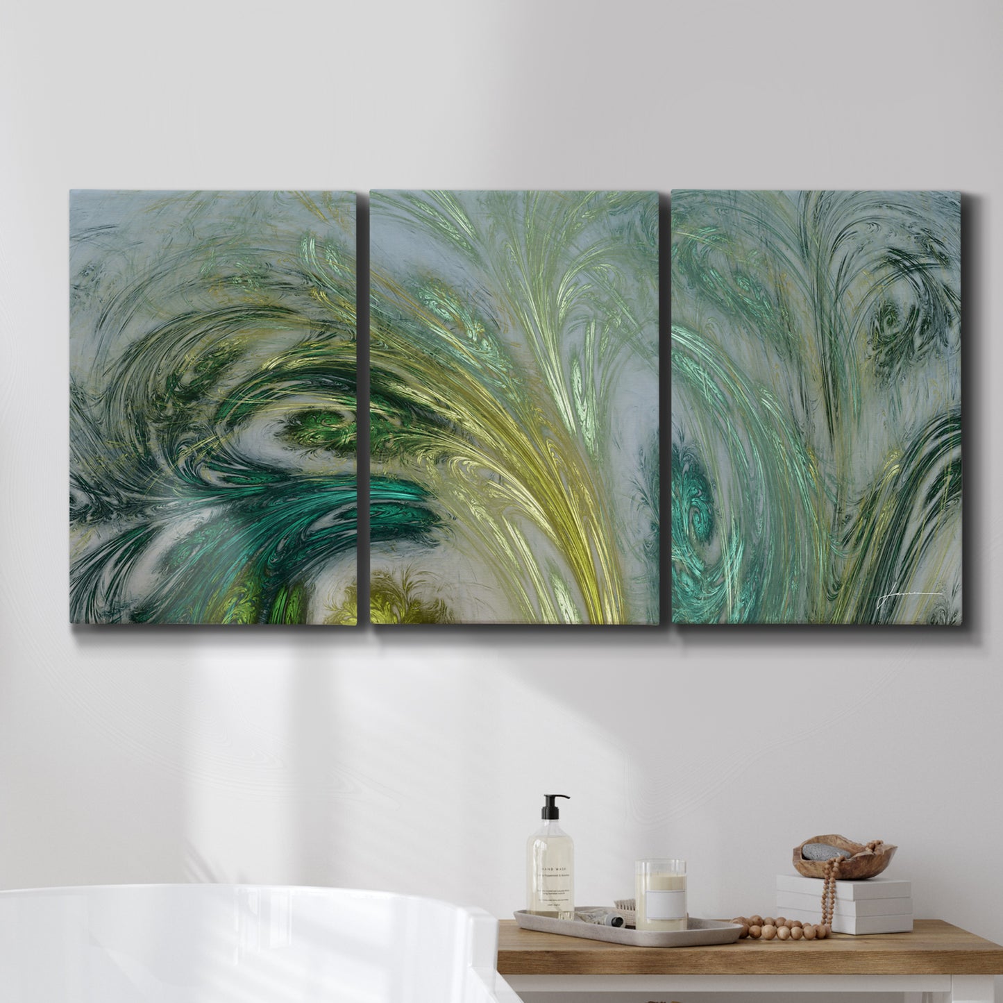 Three-panel canvas wall art featuring layered modern abstract landscape, displayed in a bathroom above a bathtub.