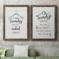 Set of two walnut barnwood framed canvas prints depicting a coordinated art pair of humorous laundry-room sayings and clothing icons rendered as rustic typographic wall art above a sofa in a modern living room.