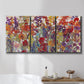 Three-panel canvas wall art featuring colorful floral arrangement, displayed in a bathroom above a bathtub.