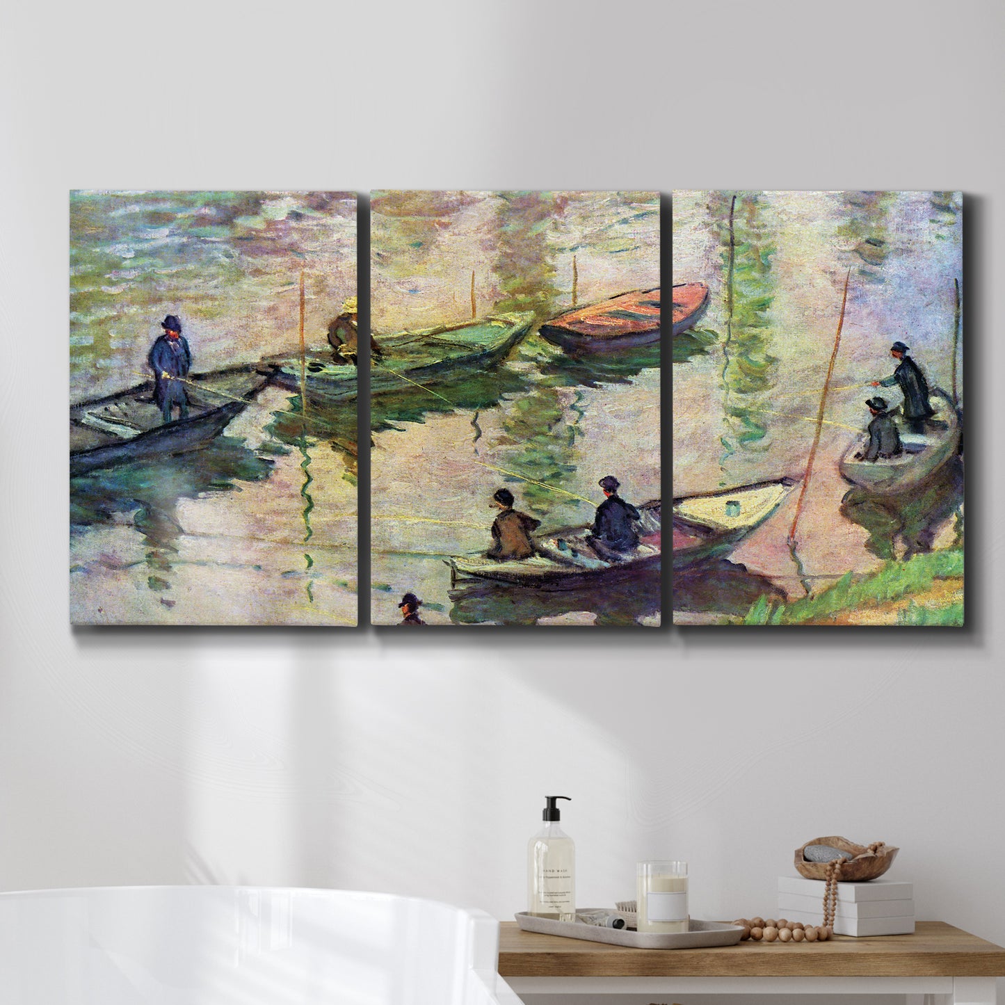 Three-panel canvas wall art featuring river scene with boats and reflections, displayed in a bathroom above a bathtub.