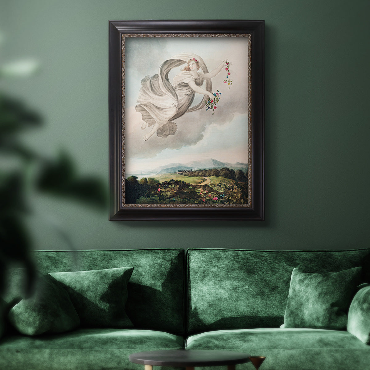 Classical allegorical depiction of the goddess Flora by Robert John Thornton in an ornate black frame with gilded inner detail displayed in a dark-toned interior setting.